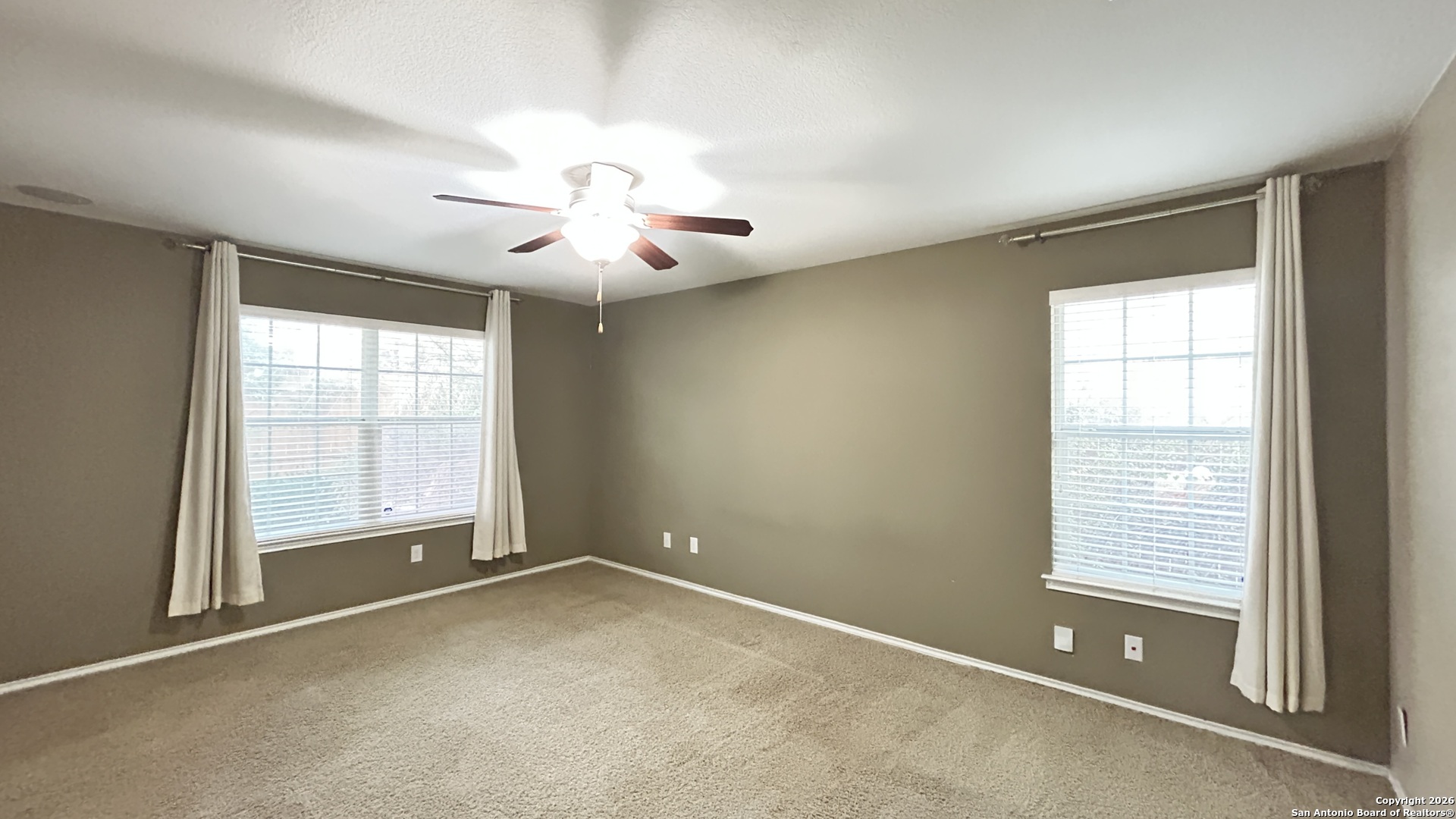 10319 Roadrunner Ridge San Antonio, TX 78245 - Photo 27 of 35 a view of an empty room with a window