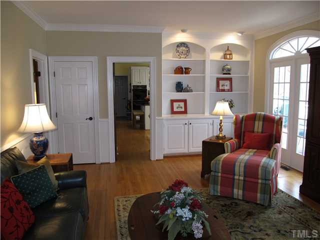 10037 Old Warden Road Raleigh, NC 27615 - Photo 7 of 25 a living room with furniture and wooden floor