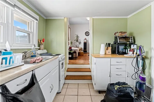 an entryway and livingroom with furniture