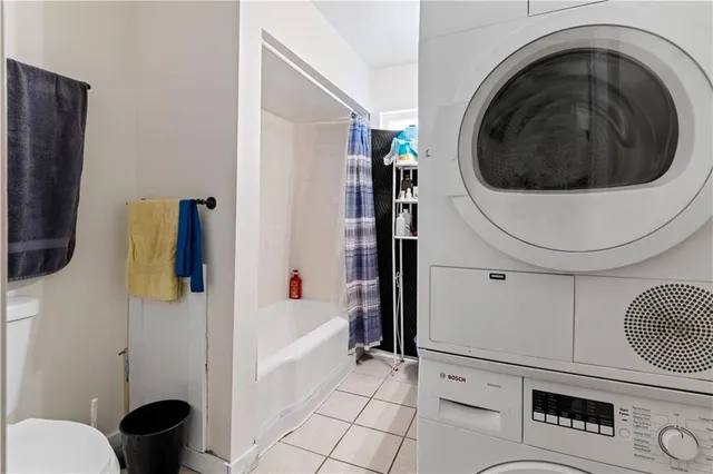 a bathroom with a sink toilet and window