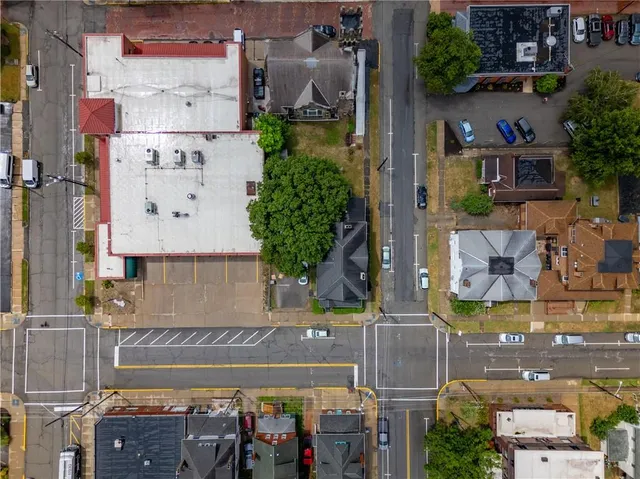 an aerial view of a house with outdoor space