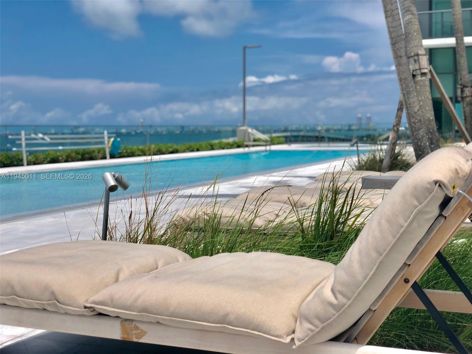 3131 Northeast 7th Avenue, Unit 3305 Miami, FL 33137 - Photo 20 of 44 a view of swimming pool with outdoor space and seating area