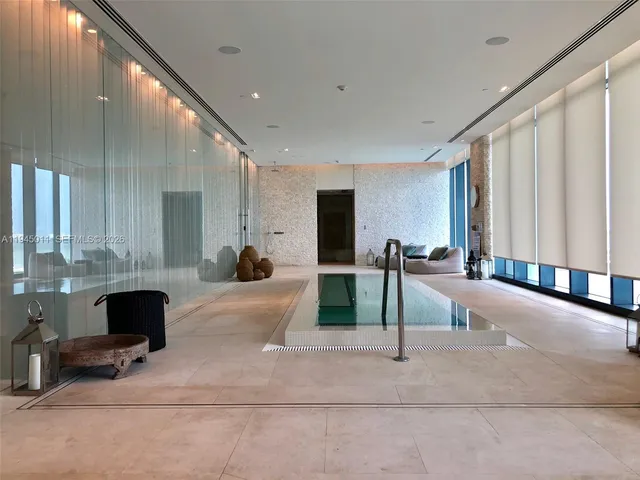 a view of a house with backyard and tree