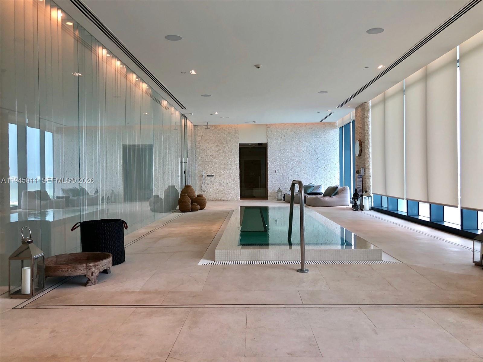 3131 Northeast 7th Avenue, Unit 3305 Miami, FL 33137 - Photo 31 of 44 a lobby with furniture and a rug