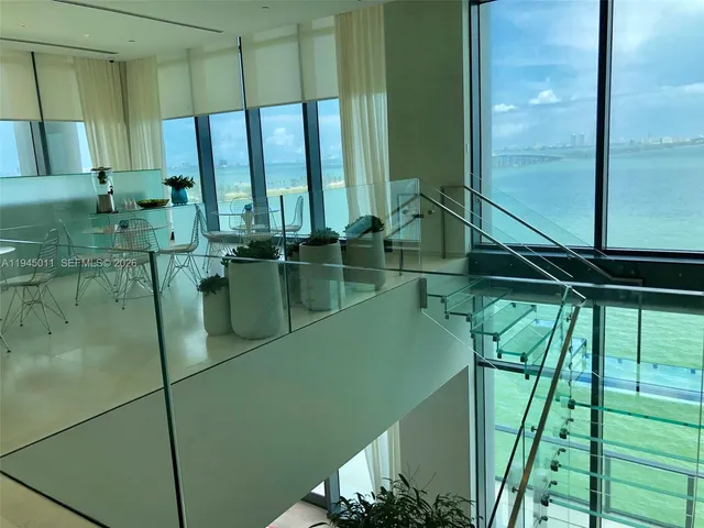 a bathroom with a bathtub and a window