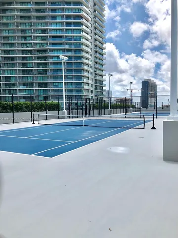 a view of swimming pool with a yard
