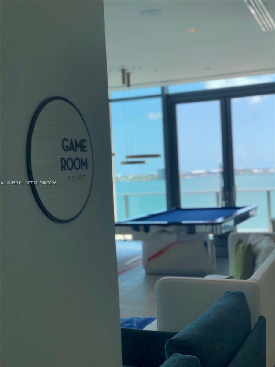 3131 Northeast 7th Avenue, Unit 3305 Miami, FL 33137 - Photo 40 of 44 a bathroom with a bathtub and a window