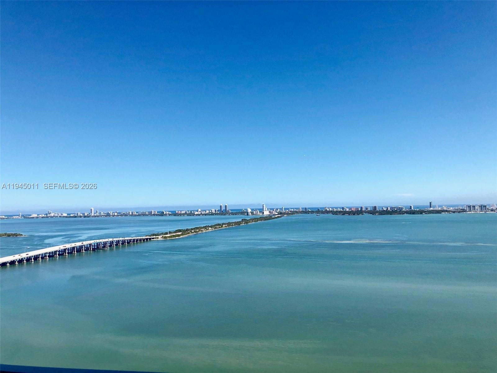 3131 Northeast 7th Avenue, Unit 3305 Miami, FL 33137 - Photo 9 of 44 a view of an ocean and city from a balcony