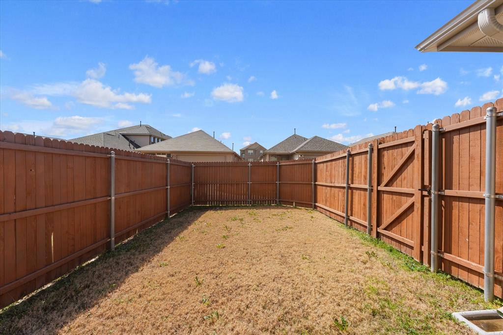 4011 Springfield Lane Crandall, TX 75114 - Photo 25 of 27 a view of a backyard