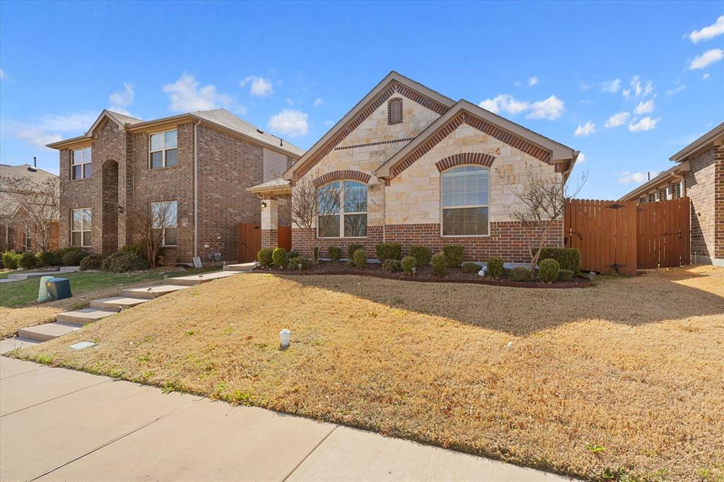 4011 Springfield Lane Crandall, TX 75114 - Photo 3 of 27 a front view of house with yard and trees in the background
