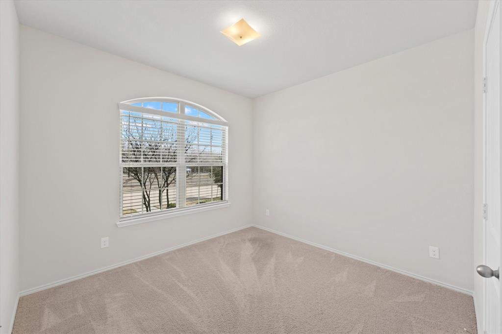 4011 Springfield Lane Crandall, TX 75114 - Photo 5 of 27 an empty room with a window