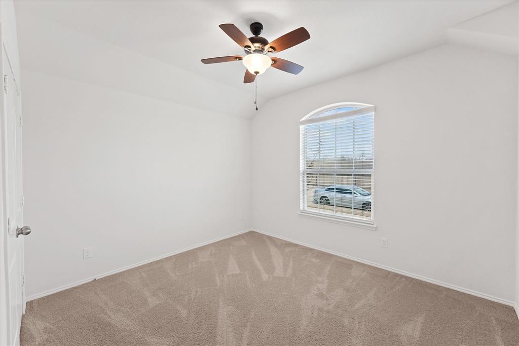 4011 Springfield Lane Crandall, TX 75114 - Photo 8 of 27 an empty room with a window and a ceiling fan