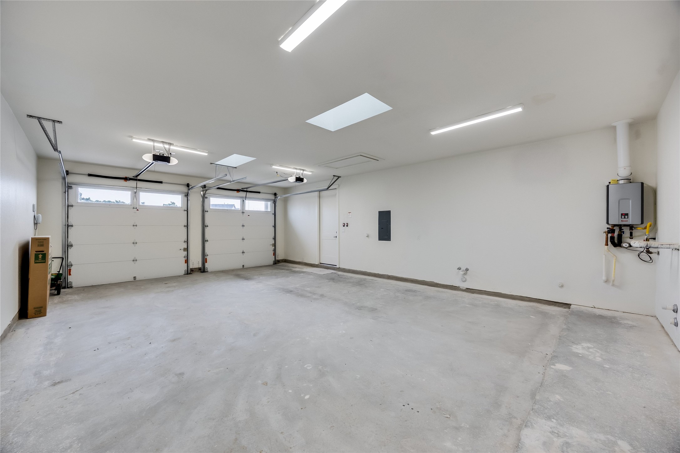 288 Smoke Tree Circle Dripping Springs, TX 78620 - Photo 36 of 40 an empty room with white walls and wooden floors