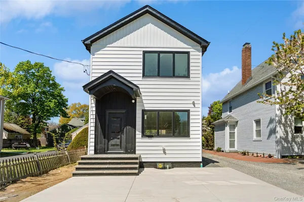 a front view of a house with a porch