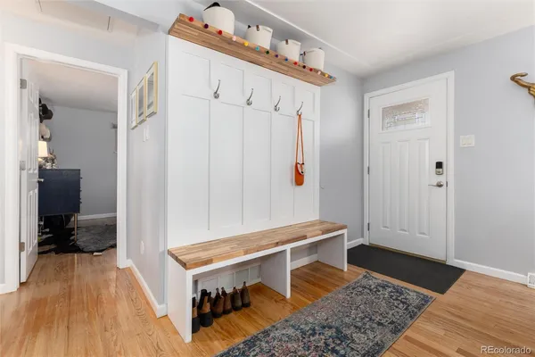 a living room with a bed and a table