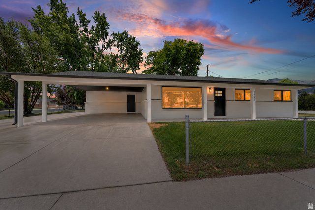 1898 West 600 South Provo, UT 84601 - Photo 1 of 32 Ranch-style exterior with a covered carport, painted white siding, and a dark asphalt shingle roof