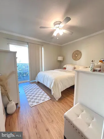 a bedroom with bed and window