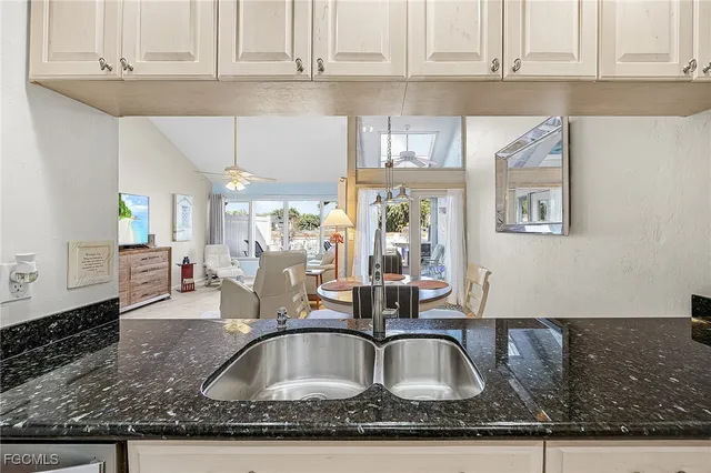 a view of entryway with furniture and wooden floor