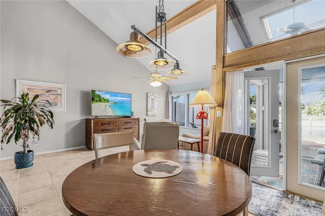 a dining room with furniture and wooden floor