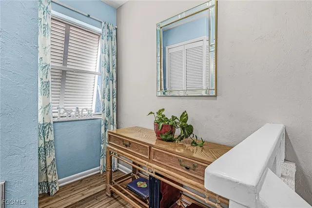 a room with wooden floor and a window