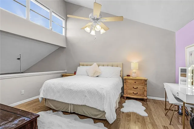 a bedroom with a bed a desk and chair