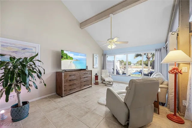 a view of a dining room with furniture and a potted plant