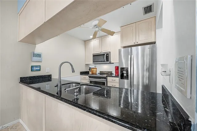 a living room with furniture potted plant and a large mirror