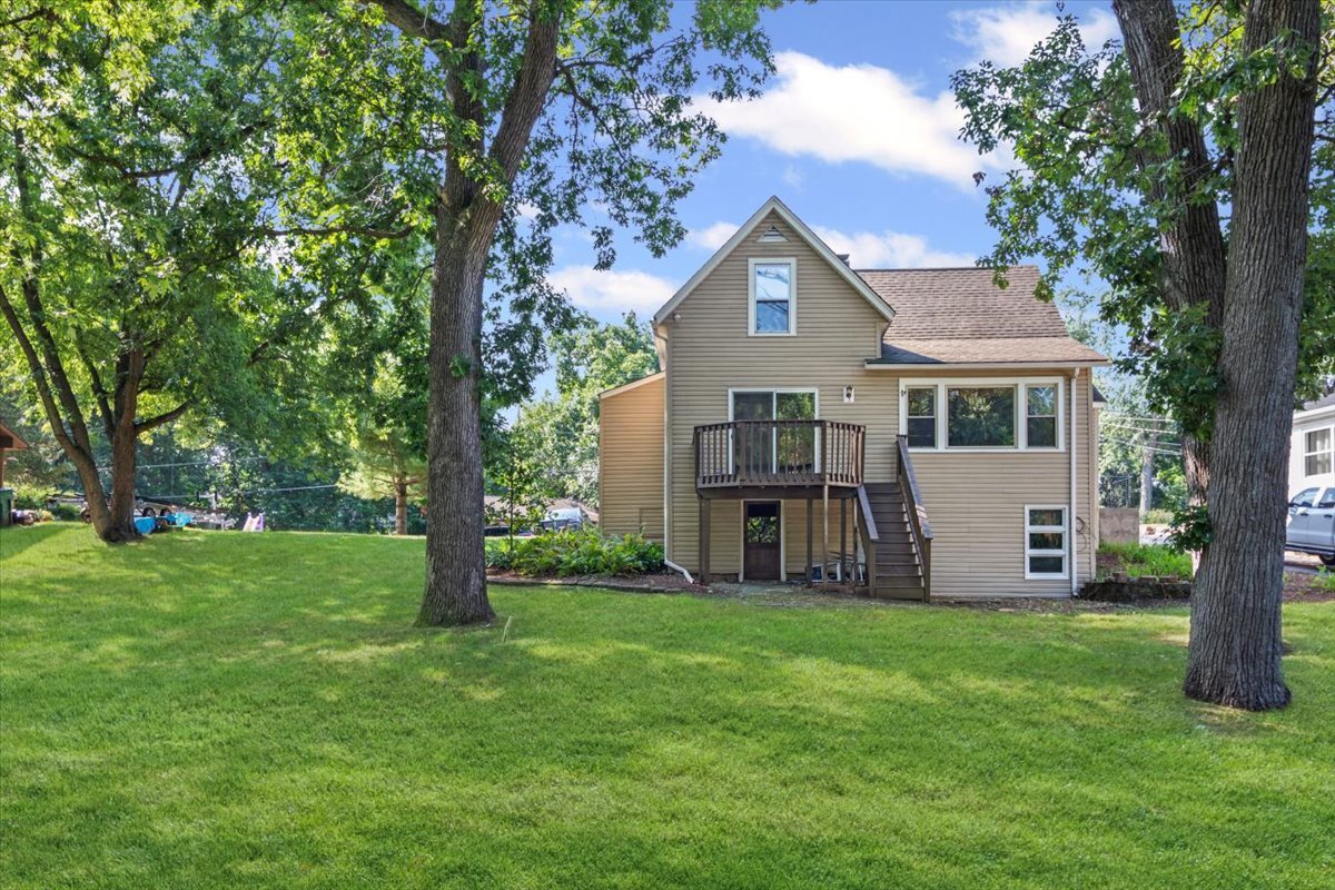 2016 Grove Lane Cary, IL 60013 - Photo 17 of 18 a front view of a house with garden