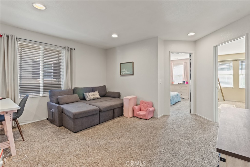 2614 Bellevue Way Palmdale, CA 93550 - Photo 14 of 28 a living room with furniture and a window