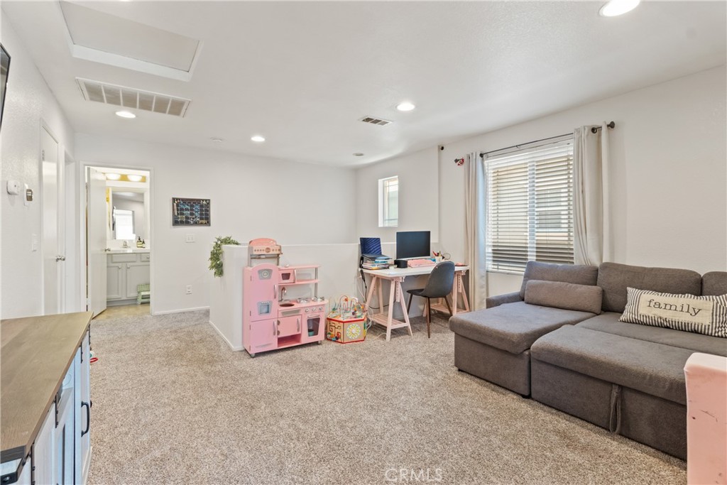 2614 Bellevue Way Palmdale, CA 93550 - Photo 15 of 28 a living room with furniture and a large window