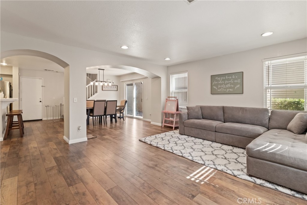 2614 Bellevue Way Palmdale, CA 93550 - Photo 5 of 28 a living room with furniture and a wooden floor