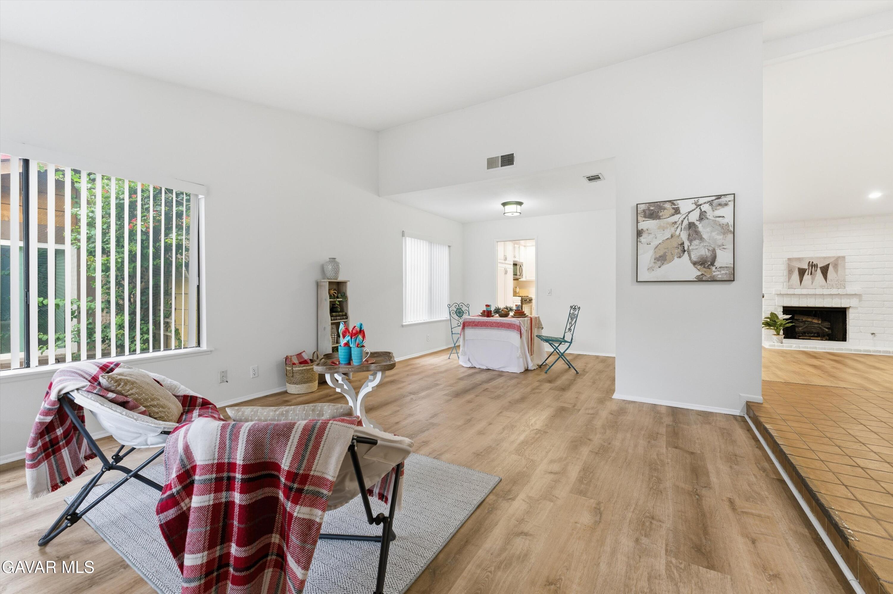 13611 Bear Valley Road Moorpark, CA 93021 - Photo 14 of 21 a living room with furniture and wooden floor