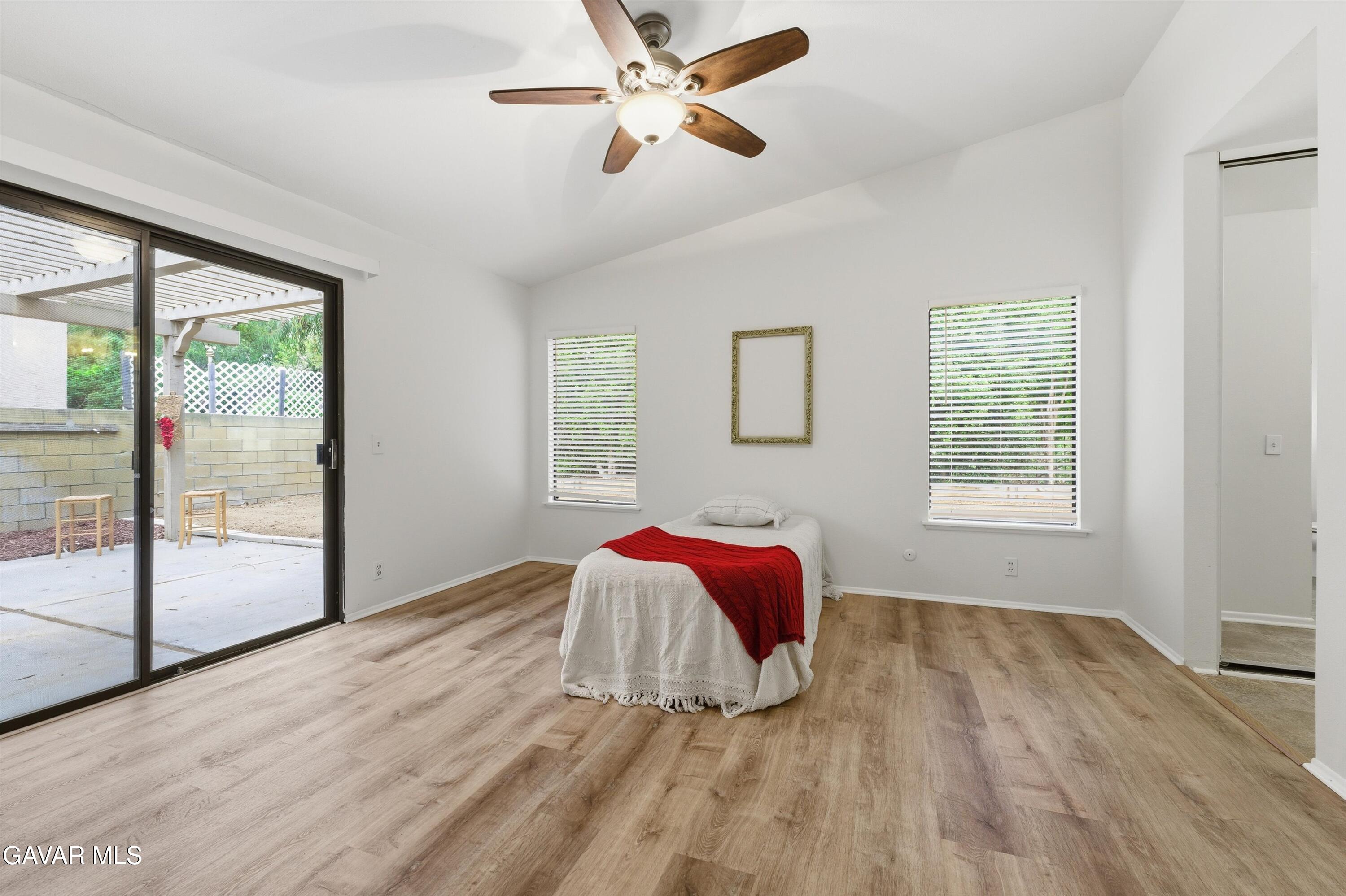 13611 Bear Valley Road Moorpark, CA 93021 - Photo 17 of 21 a view of a livingroom with wooden floor and a chandelier fan