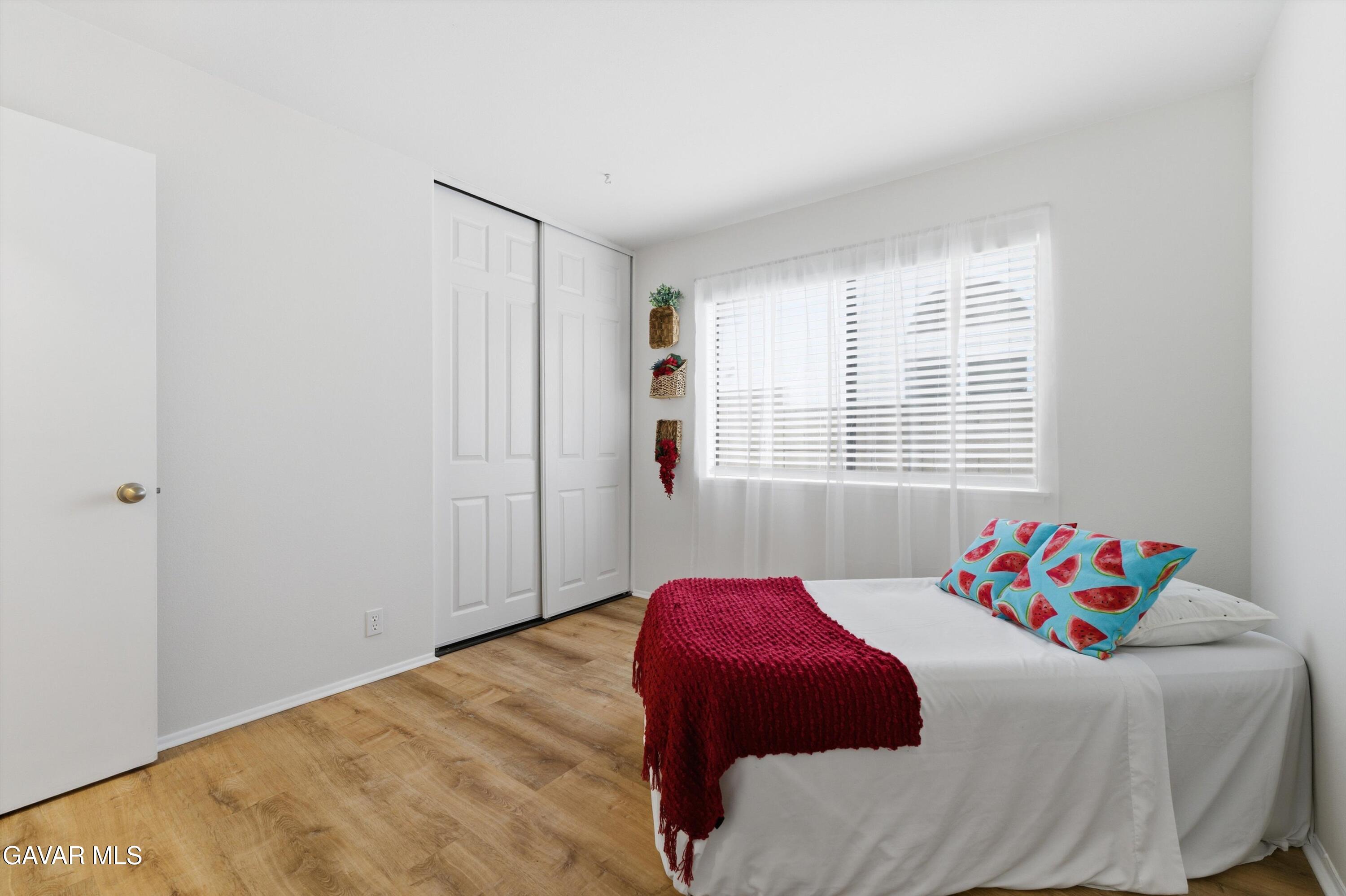 13611 Bear Valley Road Moorpark, CA 93021 - Photo 20 of 21 a bedroom with a bed and a window