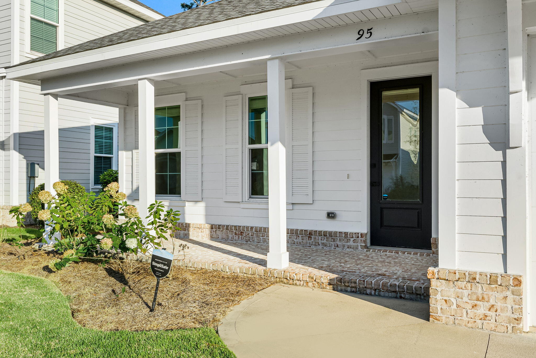 95 Conifer Ct Inlet Beach Inlet Beach, FL 32461 - Photo 4 of 33 a front view of a house with a yard