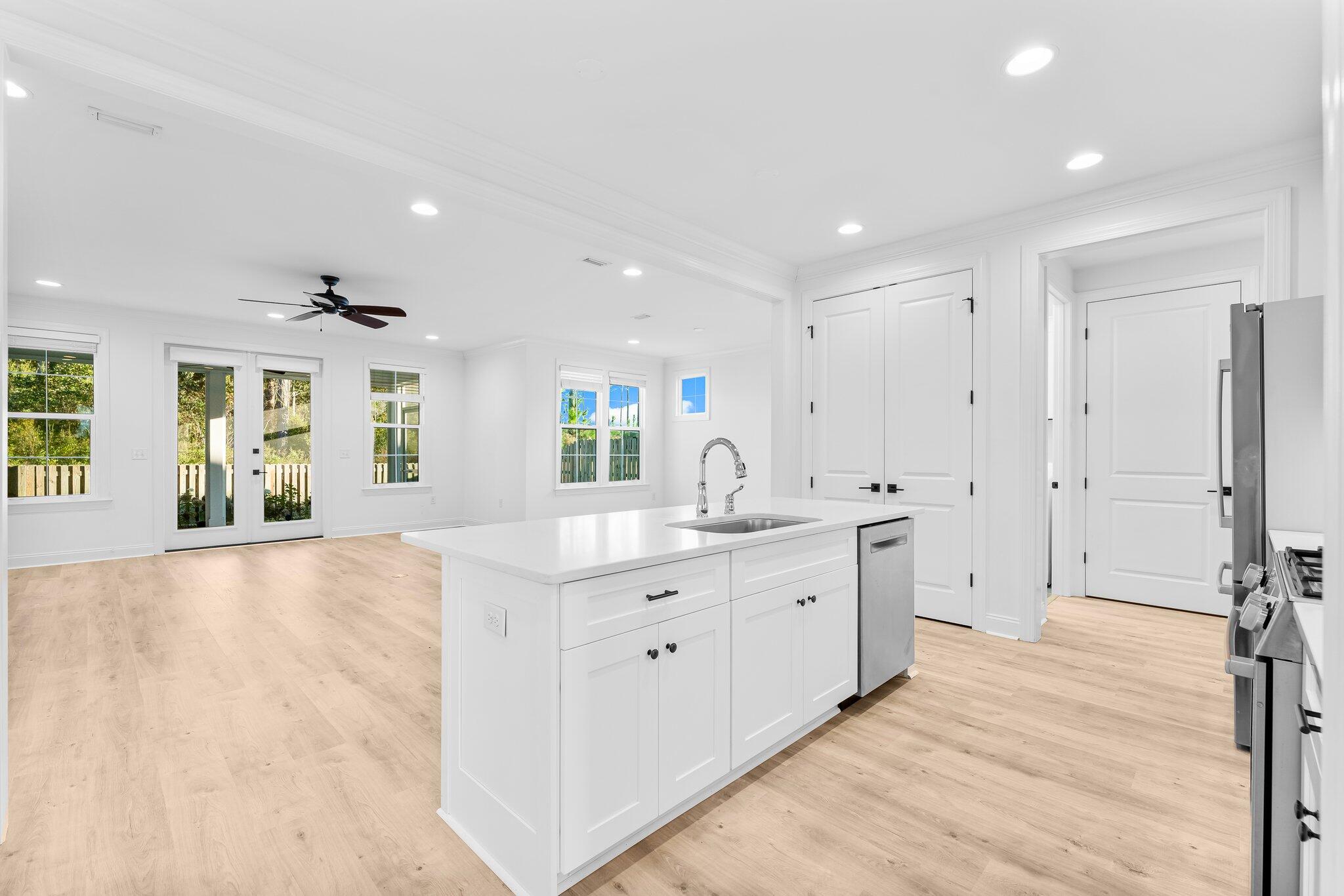 95 Conifer Ct Inlet Beach Inlet Beach, FL 32461 - Photo 8 of 33 a large bathroom with a granite countertop sink a large mirror and a bathtub