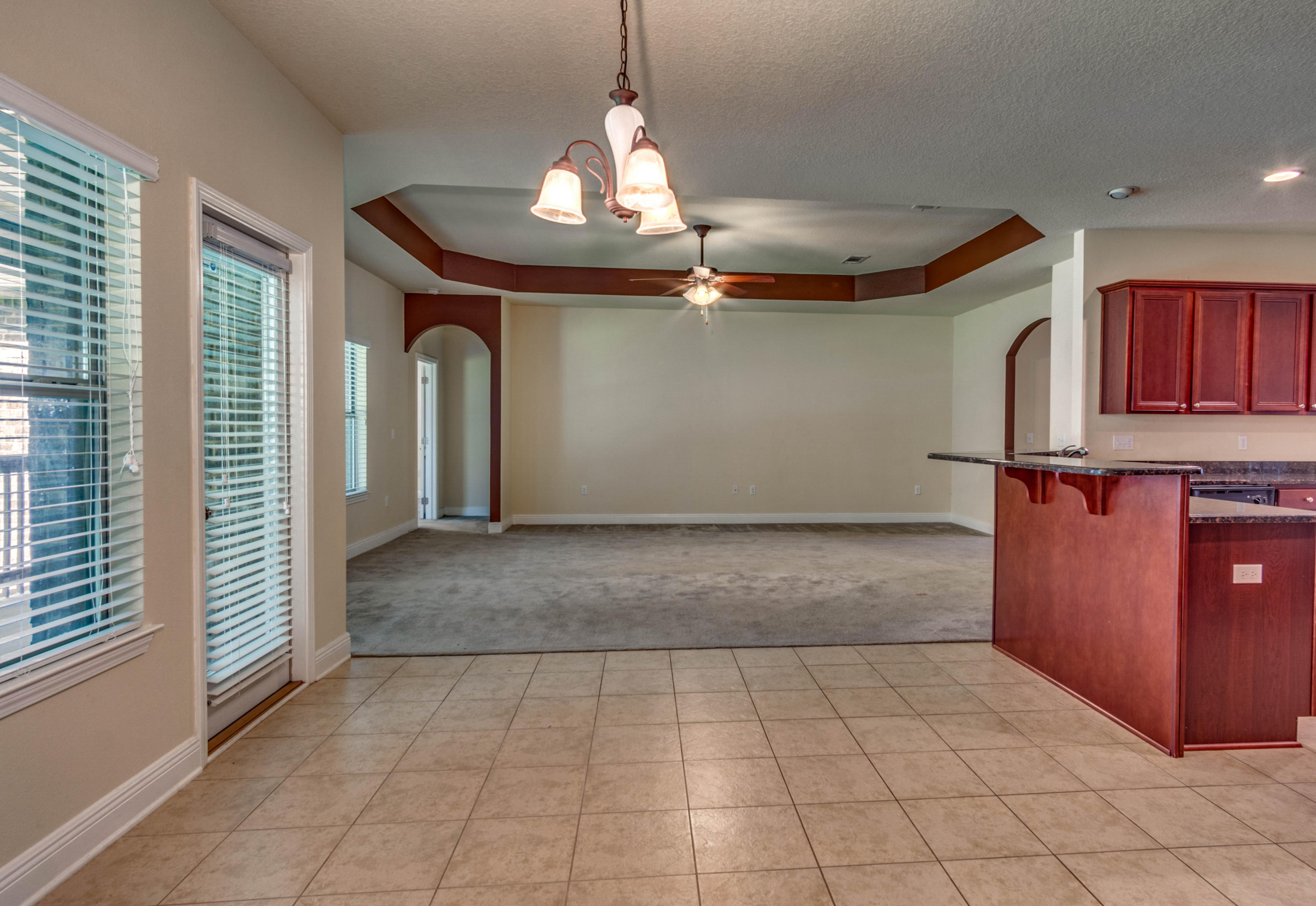 642 Red Fern Road Crestview, FL 32536 - Photo 15 of 32 a view of a livingroom with a ceiling fan and window