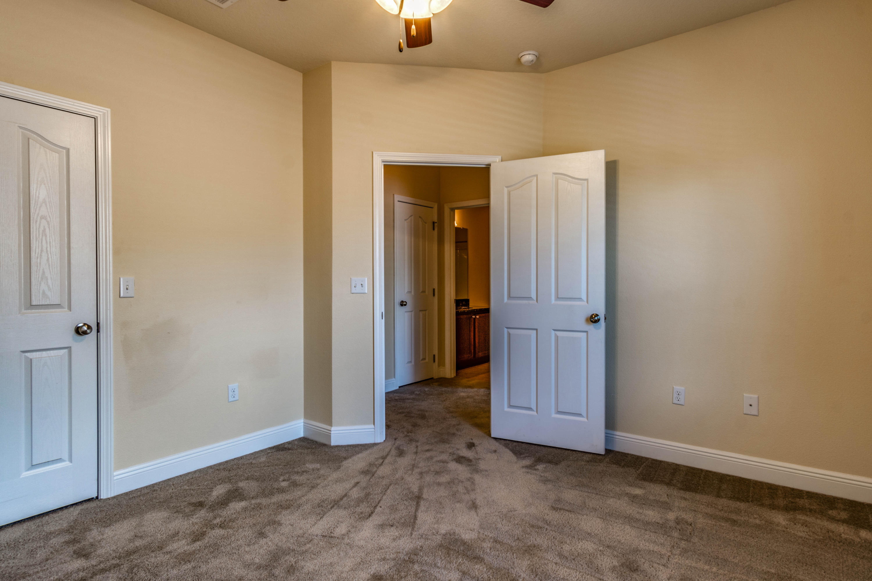 642 Red Fern Road Crestview, FL 32536 - Photo 18 of 32 an empty room with closet and wooden door
