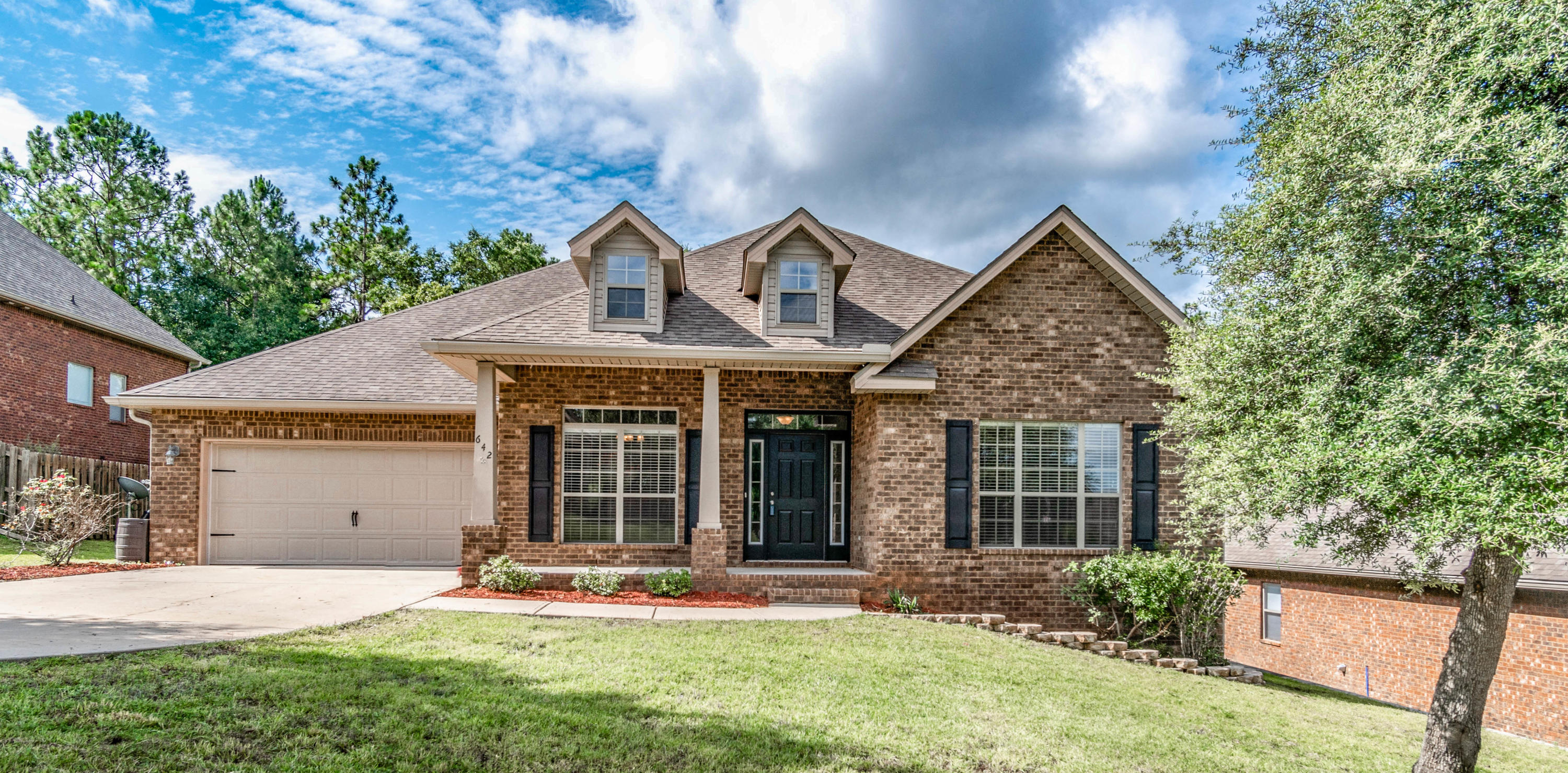 642 Red Fern Road Crestview, FL 32536 - Photo 2 of 32 front view of a house with a yard
