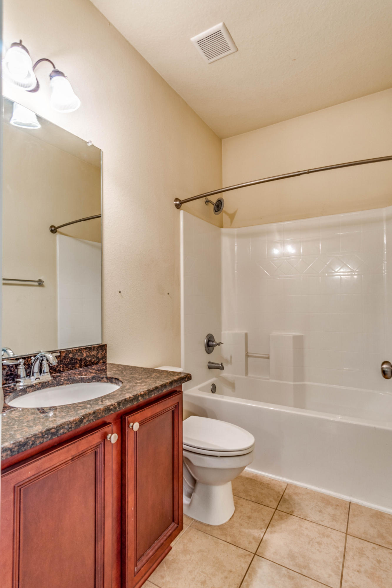 642 Red Fern Road Crestview, FL 32536 - Photo 24 of 32 a bathroom with a granite countertop sink toilet and shower