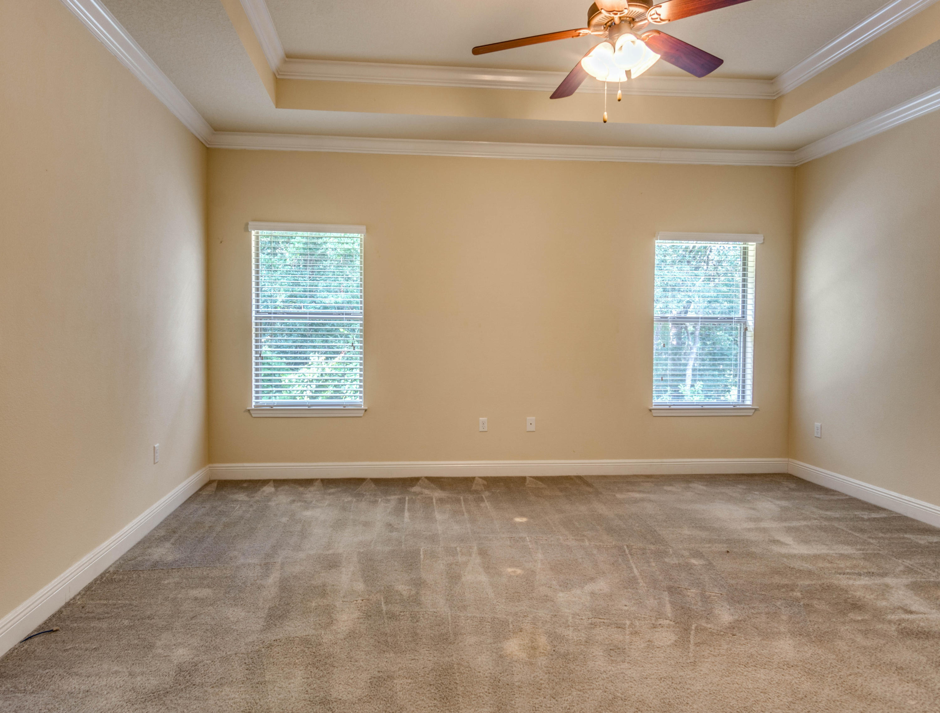 642 Red Fern Road Crestview, FL 32536 - Photo 27 of 32 an empty room with a window and a ceiling fan