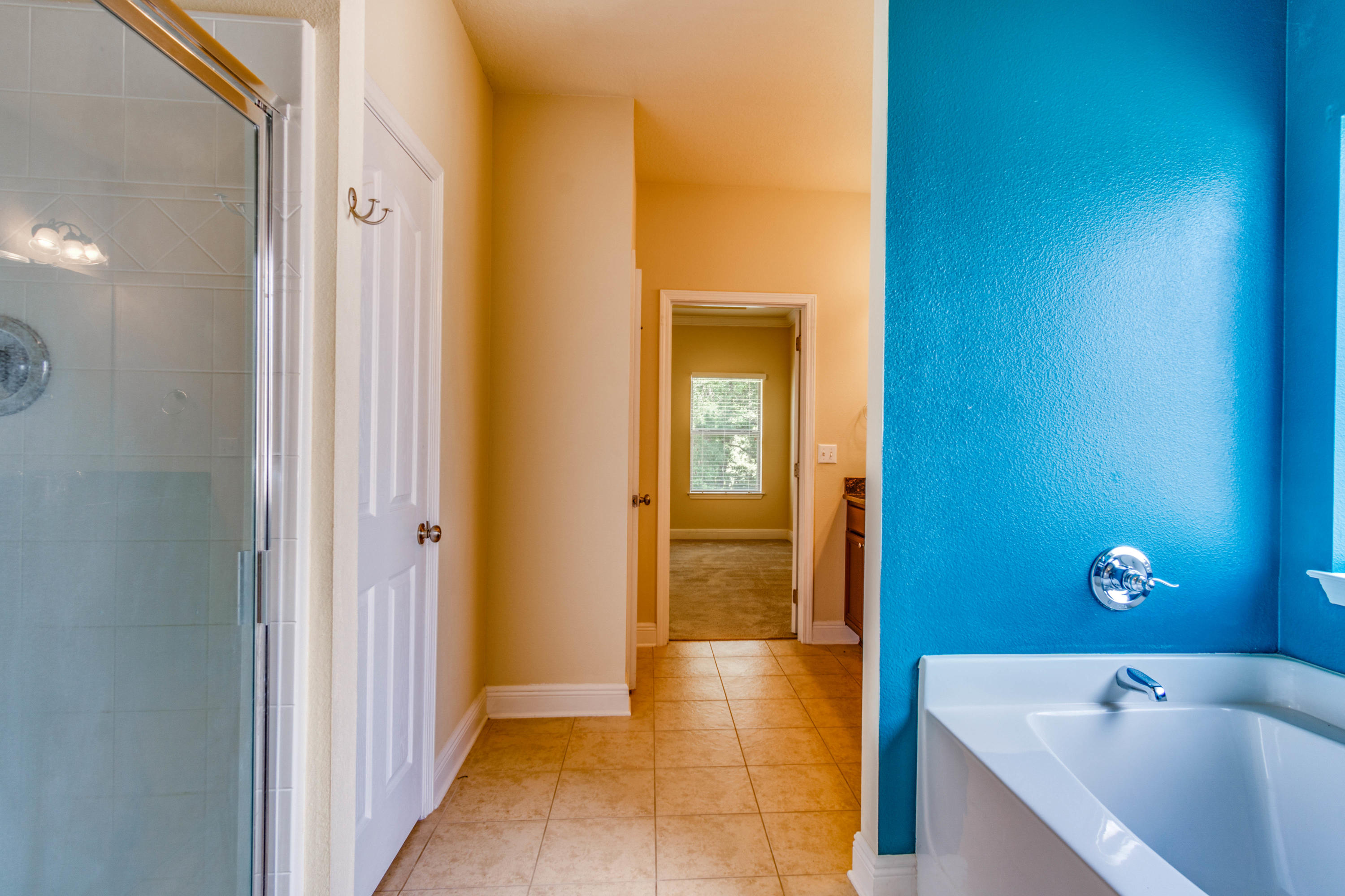 642 Red Fern Road Crestview, FL 32536 - Photo 32 of 32 a bathroom with a tub and shower