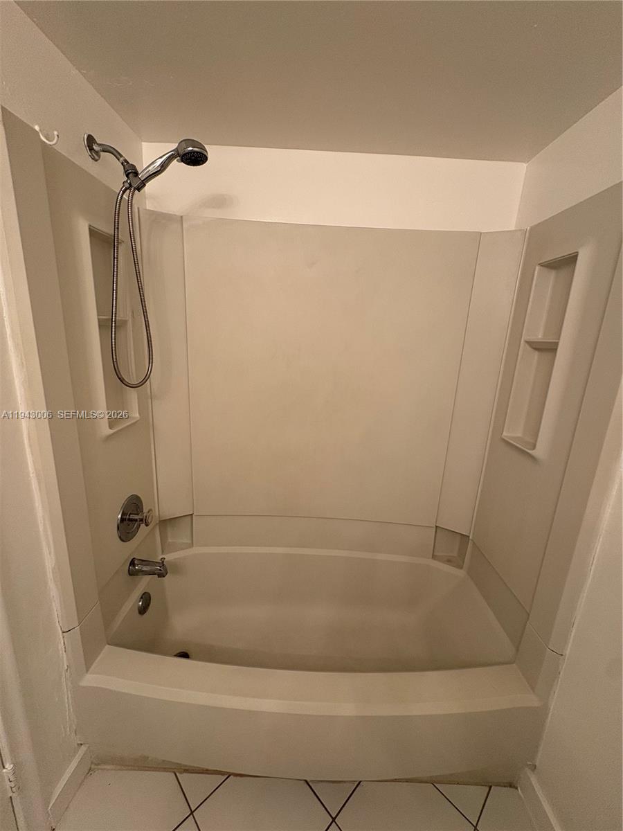 2401 Riverside Drive, Unit 314B Coral Springs, FL 33065 - Photo 12 of 16 a bathroom with a bathtub
