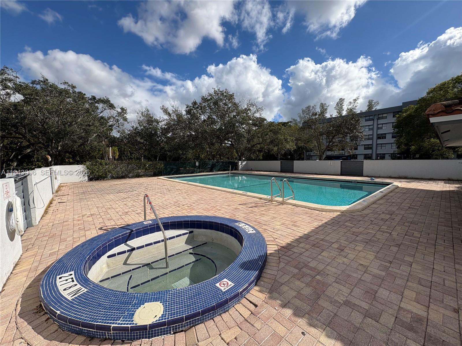 2401 Riverside Drive, Unit 314B Coral Springs, FL 33065 - Photo 14 of 16 a view of swimming pool with seating space