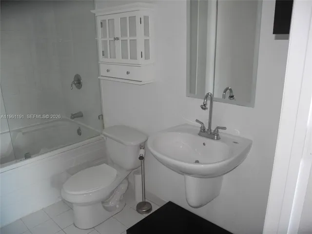 a bathroom with a toilet sink and bathtub