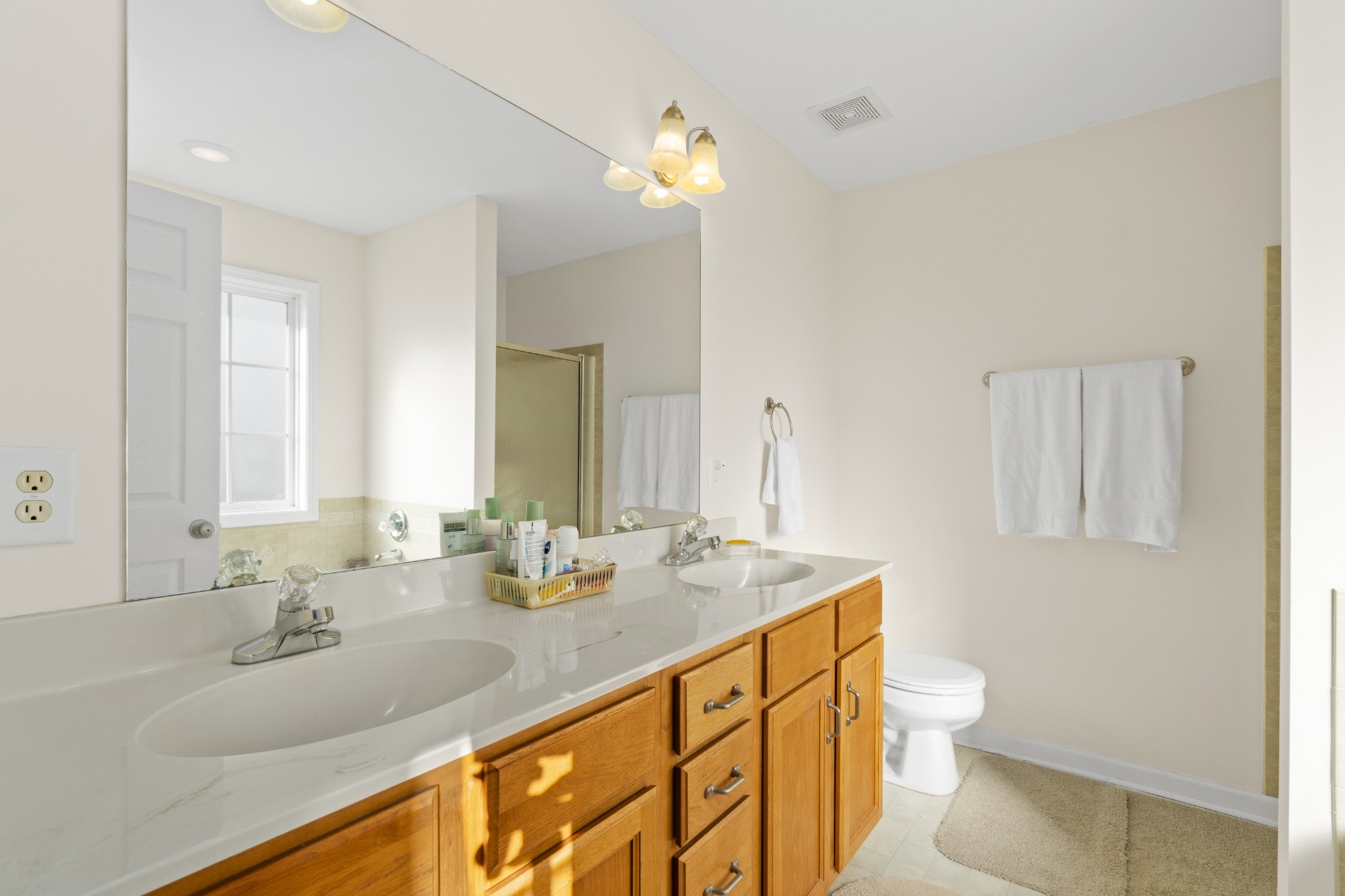 3255 Rossview Road Clarksville, TN 37043 - Photo 22 of 34 a bathroom with a granite countertop sink a toilet and a mirror