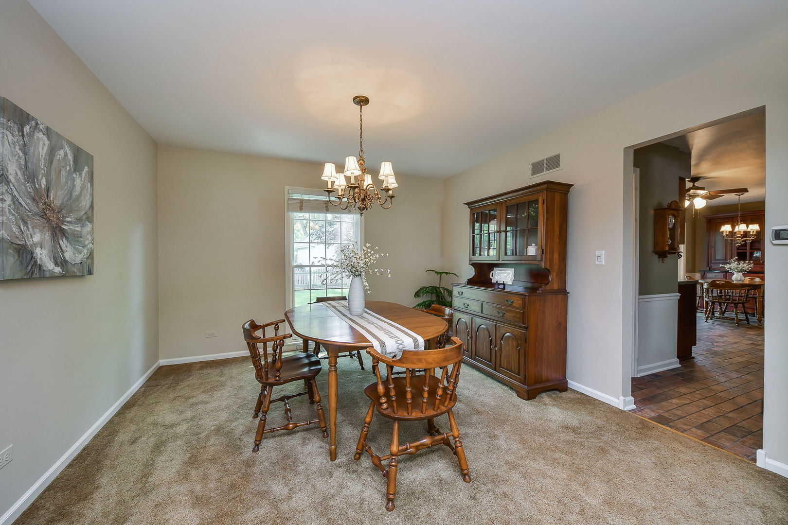 116 West Bailey Road Naperville, IL 60565 - Photo 3 of 27 a view of a dining room with furniture and chandelier