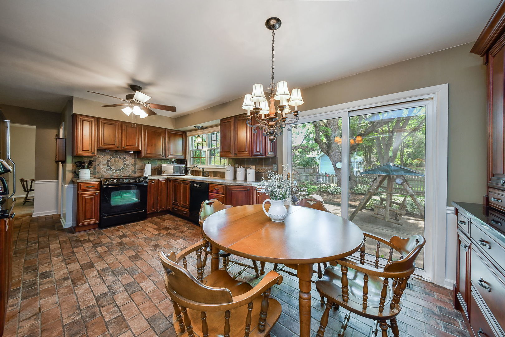 116 West Bailey Road Naperville, IL 60565 - Photo 7 of 27 a dining room filled with furniture and a chandelier