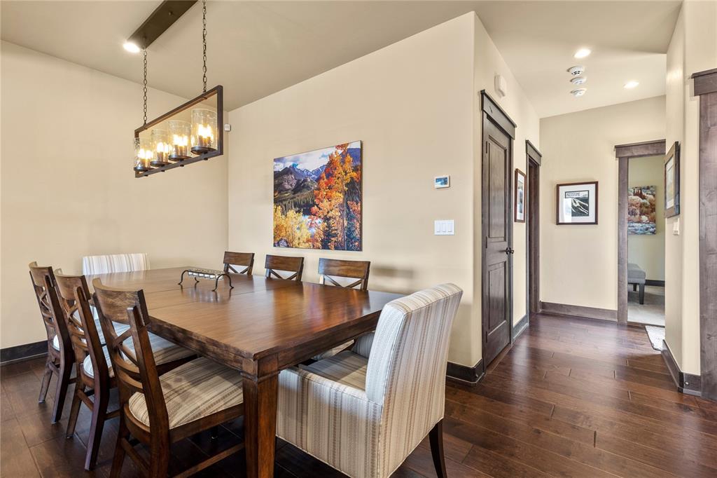 874 Independence Road, Unit 874 Keystone, CO 80435 - Photo 11 of 35 a view of a dining room with furniture and wooden floor