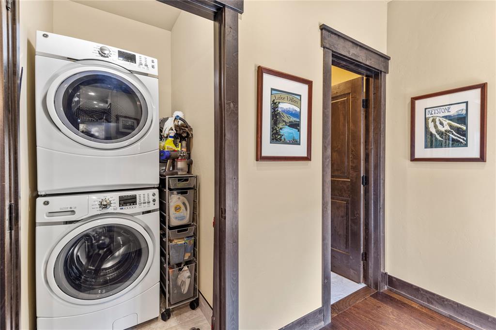 874 Independence Road, Unit 874 Keystone, CO 80435 - Photo 12 of 35 a view of a hallway with washer and dryer